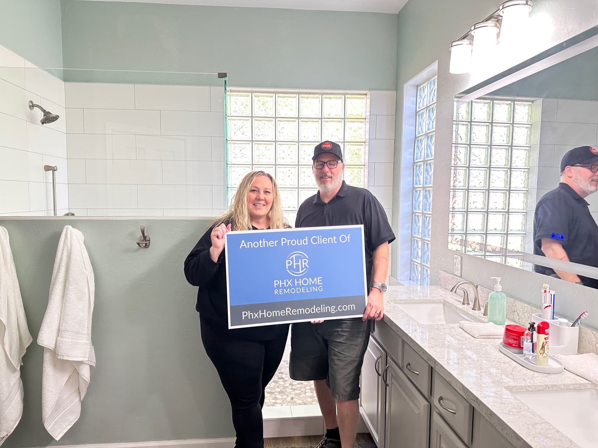 Happy homeowner from bathroom remodel service Happy homeowner from bathroom remodel service