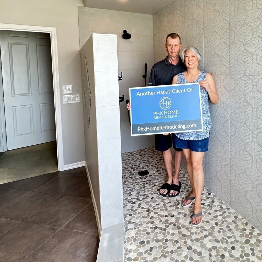 Barbara and Gary S holding PHR sign 2 Barbara and Gary S holding PHR sign 2